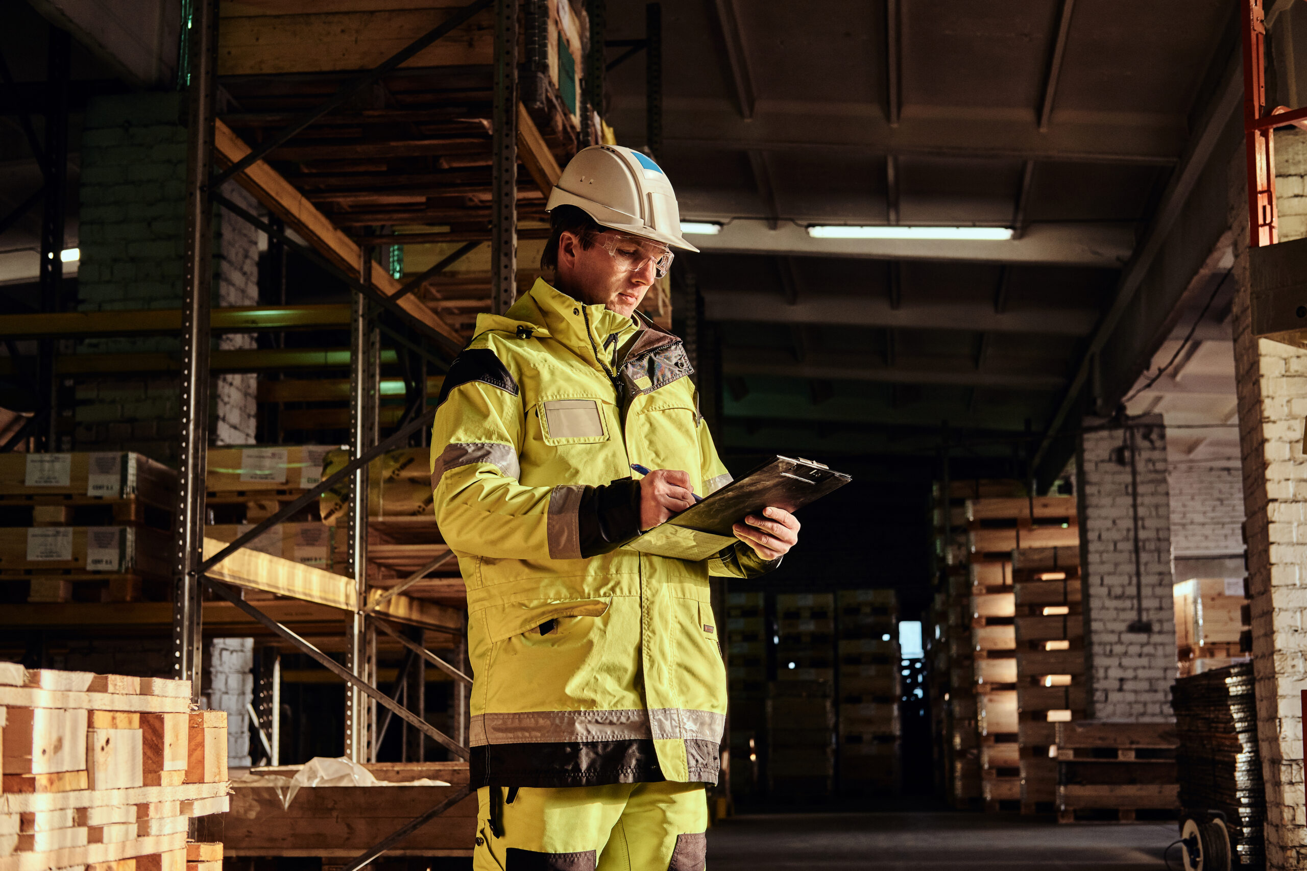 Safety manager reviewing paperwork on site